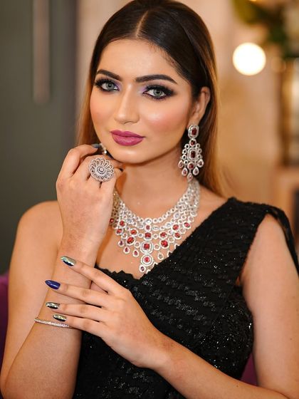 This portrait showcases the complete bold glam look, from the makeup and jewelry to the perfectly coordinated nails.