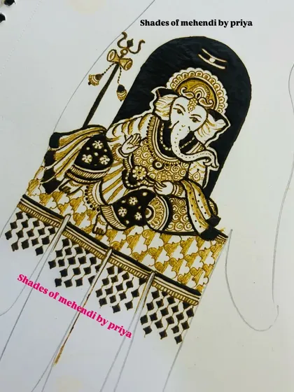 The completed Ganesha figure on a practice sheet. We work on paper to perfect the lines, shading, and details before applying the design on skin.