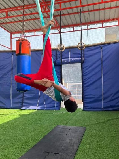 Another variation of an inverted pose for kids. We always keep it playful and encourage them to explore different shapes with their bodies.