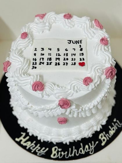A unique calendar-themed birthday cake, marking a special day in June.