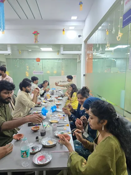 I can bring the entire pottery workshop right to your office. Here’s a look at a full team engaged in a festive diya painting session, a perfect way to celebrate together.