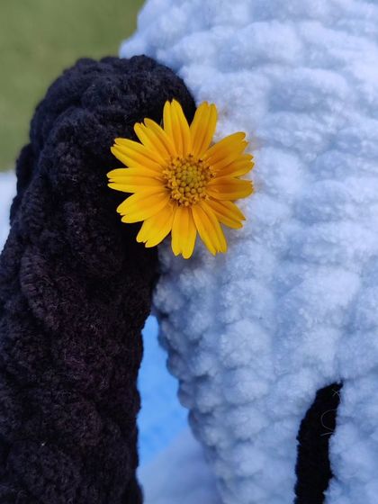 A close-up of the flower detail on my handmade Snoopy plushie.