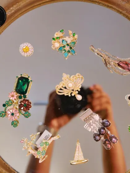 Our brooch collection is full of personality. Find your perfect match, whether it's a sparkling panda, a whimsical sailboat, a floral bouquet with an emerald green stone, or a pearl-adorned crown. These are pieces you won't find on Amazon.