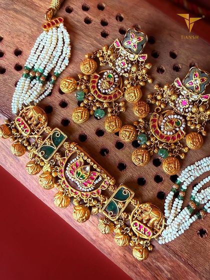 Part of my 'Jhanak' collection, this choker and earring set brings heritage to life with regal elephant and peacock motifs, vibrant meenakari, and the chime of gold coins.