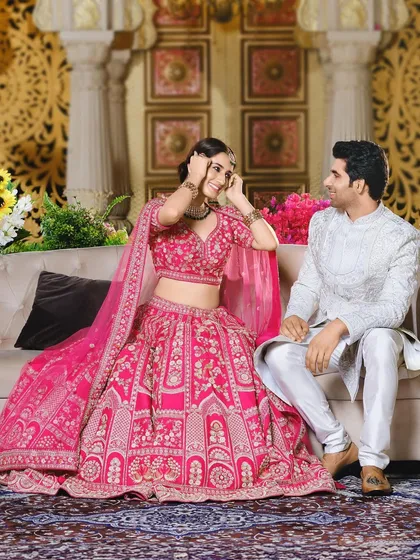 A duplicate of the previous image, showing the same joyful interaction and coordinated outfits.