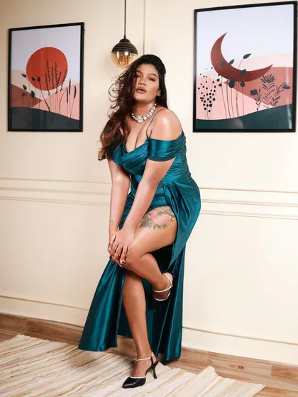 A full-body shot to showcase the entire elegant look, from the off-shoulder dress to the heels. This is the kind of shot that works well for both portfolios and brand lookbooks.