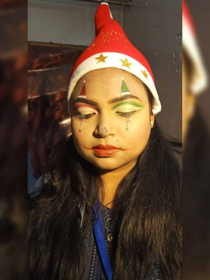 This is the same Christmas jester look, showing how lighting can affect makeup. Students are taught to consider how their work will appear in different environments.