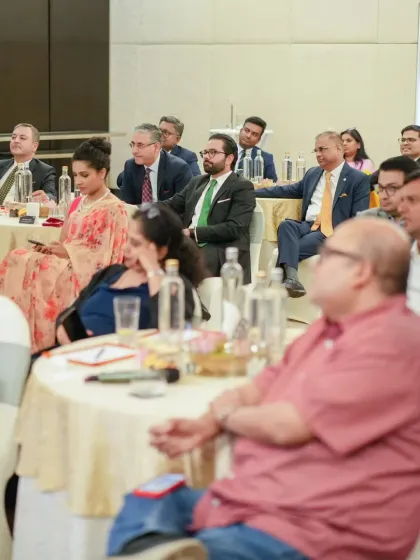The audience at a corporate event, listening intently to the speaker. Our venues are arranged to facilitate focus and comfort for all attendees.
