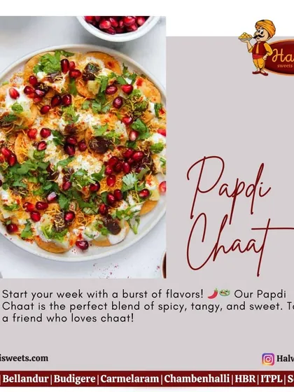 A close-up of my delicious Papdi Chaat, generously topped with creamy yogurt, tangy chutneys, fresh cilantro, and glistening pomegranate seeds for a burst of flavor.
