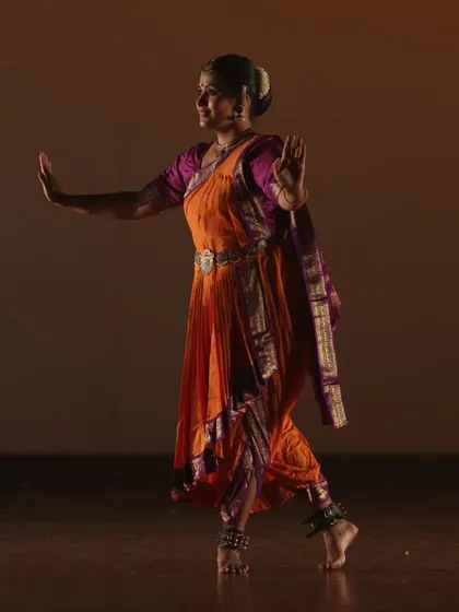 An instructor performing Bharatanatyam with poise and expression. Our classes honor the rich traditions of Indian classical dance, focusing on intricate footwork, hand gestures, and storytelling.
