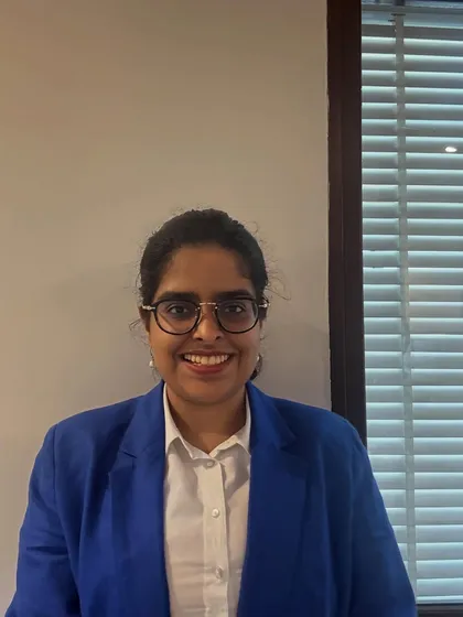 A simple, professional headshot in a blue blazer, reflecting my approachable yet focused personality.