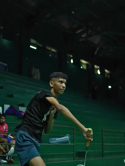 The focus and determination in a player's eyes as he prepares to return a shot.