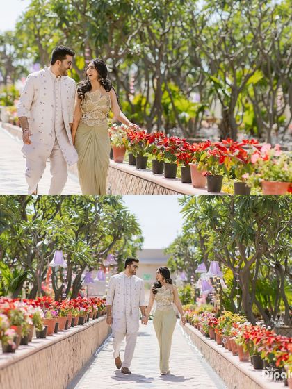 A diptych showing a couple walking and talking along a flower-lined path during their Mehendi event. It captures the natural chemistry and beautiful scenery.
