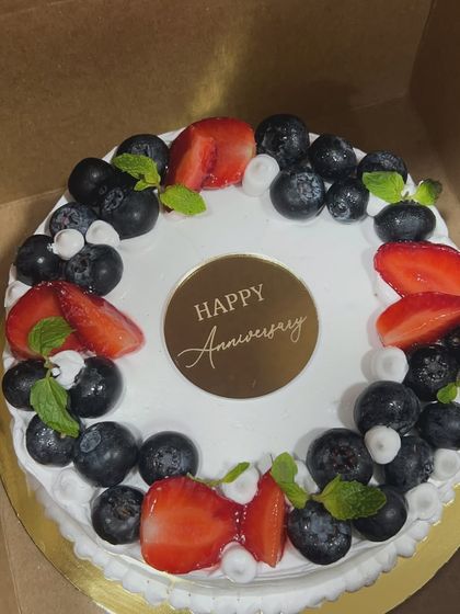 Sometimes the simplest cakes taste the best. This anniversary cake is topped with fresh blueberries and strawberries, a classic and delicious combination that never disappoints.