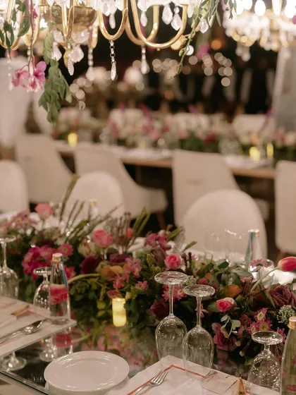 A finale dinner planned to perfection. This tablescape shows our meticulous attention to detail, from the color palettes and fresh floral arrangements to the specific glassware and crockery chosen to create a cohesive, luxurious dining experience.