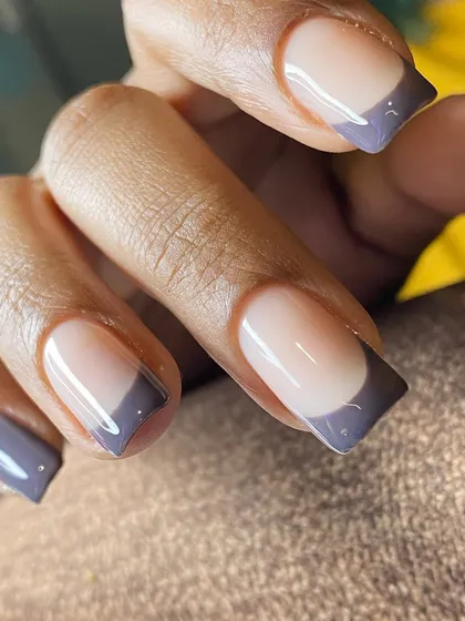 A deep grey French tip on a perfectly shaped square nail. This is a modern, sophisticated, and edgy take on the classic French.