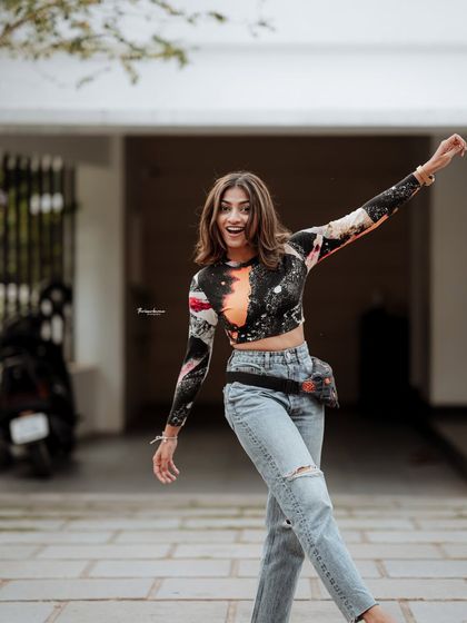 A joyful and energetic portrait capturing a candid moment of movement. I love bringing out the playful side of my subjects during a shoot.