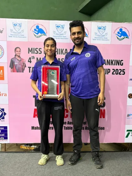 A close-up shot with Naisha Rewaskar and her winner's trophy at the 4th State Ranking Tournament. Her dedication to the sport is evident in her consistent victories across multiple age groups.