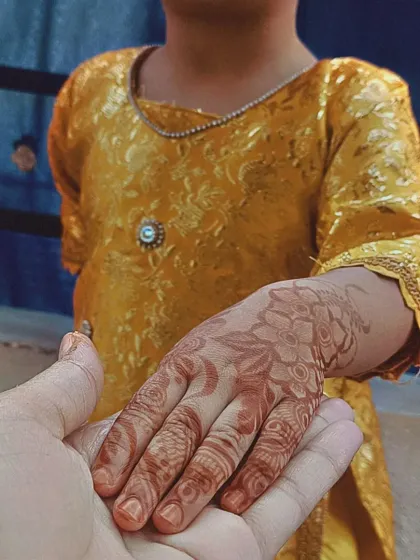 This photo shows the beautiful, rich brown stain my organic henna leaves after a day. I love this artistic shot holding my niece's hand, showing the lovely floral design that has fully developed. A great stain is a sign of pure, chemical-free henna.