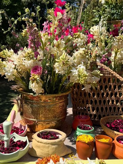 A beautiful display of organic gulal and flower petals for the Holi celebration. We believe in using high quality, natural elements to enhance the festive experience.