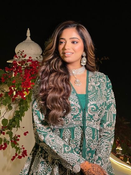 A candid shot of the bride. Her soft, open waves look glamorous yet feel effortless, allowing her to be comfortable throughout the event.