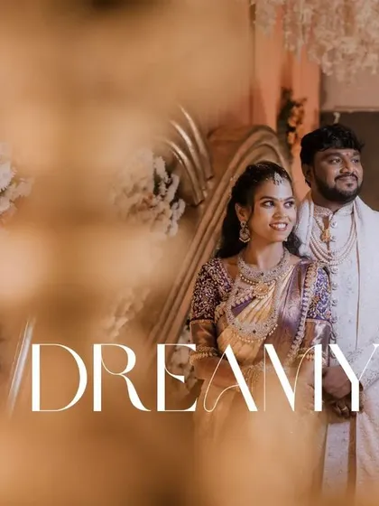A dreamy reception photo, shot through a foreground element to create a sense of intimacy and focus. This technique adds an artistic and cinematic quality to your couple portraits.