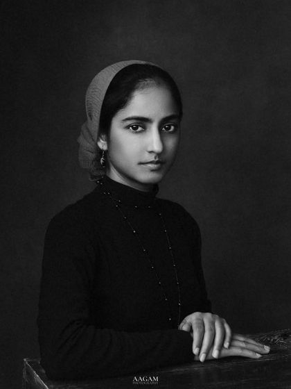 "Find your voice in the silence of creation." This classic, painterly portrait in monochrome has the gravitas of a historical photograph.