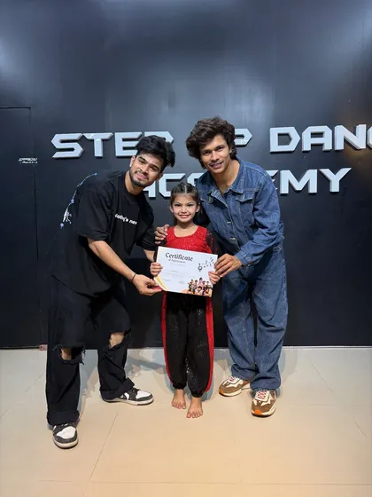 Himani, proudly holding her certificate after 4 weeks of intense training.