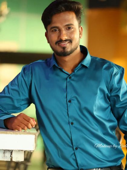 A relaxed portrait of a male actor. The makeup is minimal and natural, designed to look good on camera without appearing heavy.