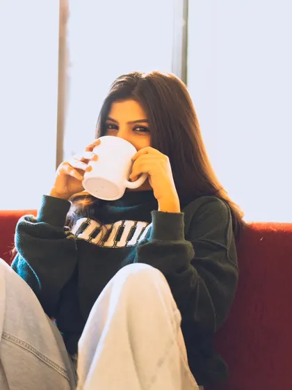 A cute and playful moment with a coffee mug. This kind of shot is great for showing personality in a lifestyle shoot.