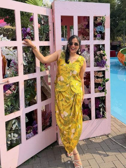 A bright and sunny yellow floral co-ord set. This outfit is perfect for a vibrant Haldi carnival or a summer-themed outdoor party.