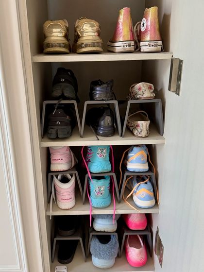 A dedicated space for a colorful sneaker collection. Using stackers allows each pair to be seen clearly, turning everyday shoes into a statement piece of the wardrobe.