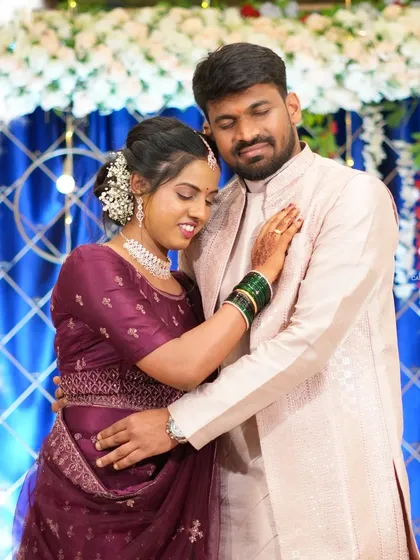 This is the kind of real, unforced moment I love to capture during an engagement or reception. It's a quiet embrace between the couple, showing their connection against the backdrop of the celebration's decor.