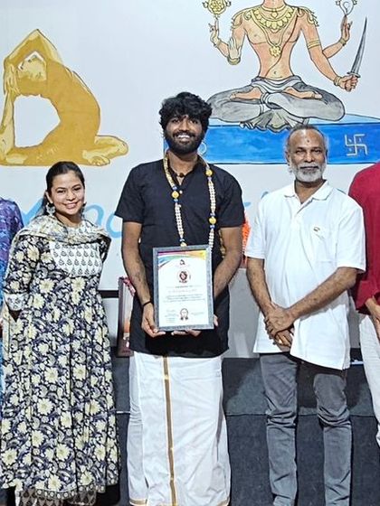 A student from our October batch proudly displays his certificate after completing the Yoga and Aerial Yoga Teacher Training.