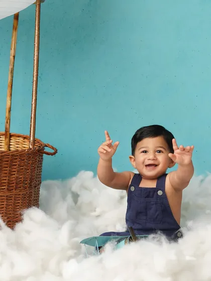 A big, joyful smile from our little adventurer. His happiness is infectious, making this a truly heartwarming photo.
