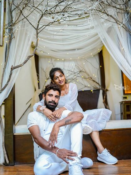 A stylish pose on the indoor bed set, showing its versatility for both romantic and modern shoots.