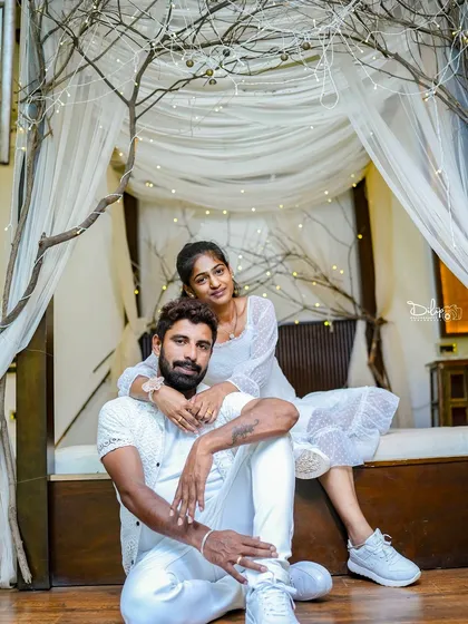 A stylish pose on the indoor bed set, showing its versatility for both romantic and modern shoots.