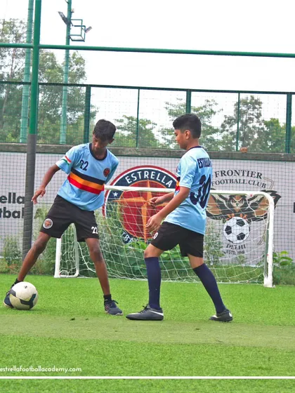 A one on one drill in front of the goal, where an attacker tries to beat a defender to get a shot off.
