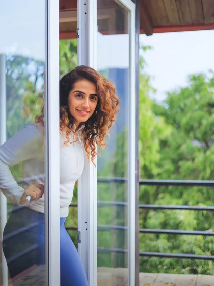 A happy, candid shot peeking through a doorway at the retreat. These gatherings are filled with as much laughter and light as they are with deep, focused practice.