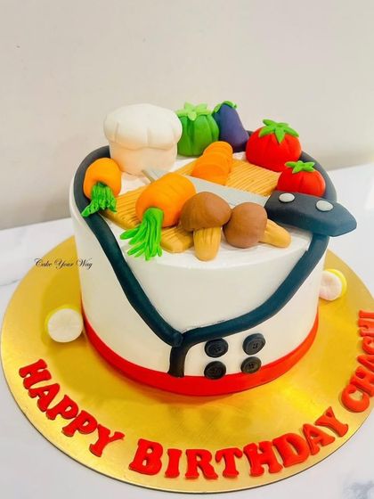 Whisking up a birthday surprise that’s chef’s kiss. This cake is a tribute to all things culinary, with fondant veggies and a chef's hat.