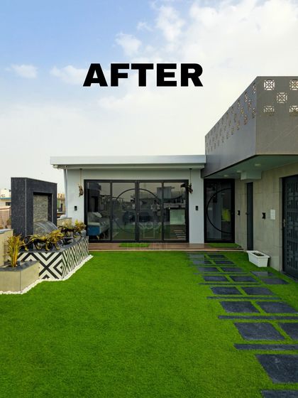 The final result of a major rooftop overhaul. The space now features a glass-walled room, a vibrant green lawn with a modern pathway, and a stylish water feature.