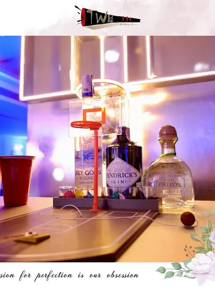 An interactive basketball-themed shot game at the bar, encouraging guest engagement and adding a playful, competitive spirit to the party.