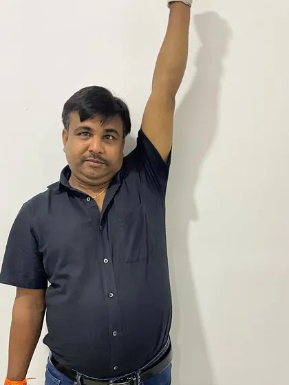 The final result of Mr. Hukum's treatment. Being able to raise his arm straight up without pain is a testament to his hard work and our collaborative therapeutic approach.