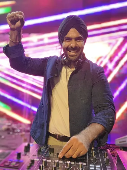 Caught in the mix, fist-pumping to a great track. I celebrate with the crowd.