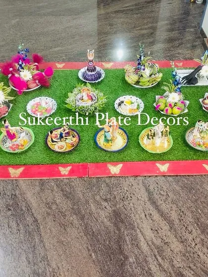 A beautiful and extensive platter arrangement for an engagement at Jenny Club. The setup includes a variety of seer items, each decorated with unique handmade dolls and flowers.