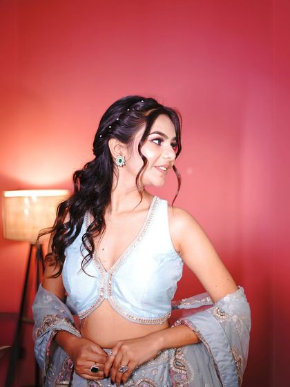 This shot gives you a better look at the halter-neck design of the blouse, a modern touch to a traditional lehenga.