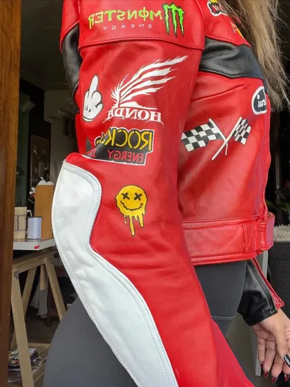 A close-up of the sleeve of my custom-painted red and black biker jacket. I hand-painted each of these "patches" to look like real ones.
