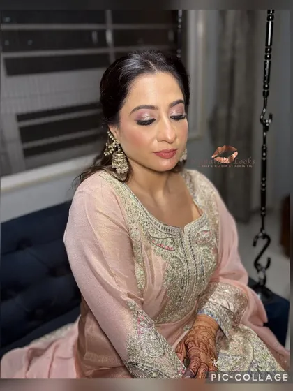 A graceful look for a Roka ceremony. The hair is styled in a soft, curly half-updo, elegantly accessorized to match her traditional outfit.