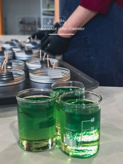 My expertise extends beyond soap. Here you can see me preparing to pour handmade candles, another product available for private label. I can help you build a complete, cohesive brand with a range of artisan-quality goods.