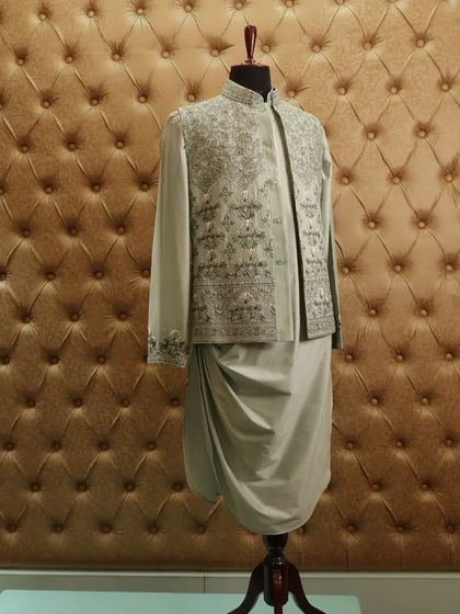 An attire that will look good on anyone. The subtle color and intricate embroidery make this a timeless and elegant choice.